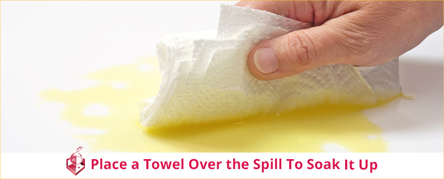 Place a Towel Over the Spill To Soak It Up