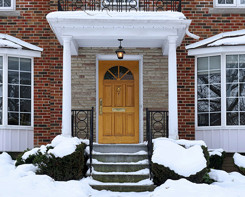House entry covered with snow