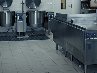 Tile and grout kitchen floor in a restaurant