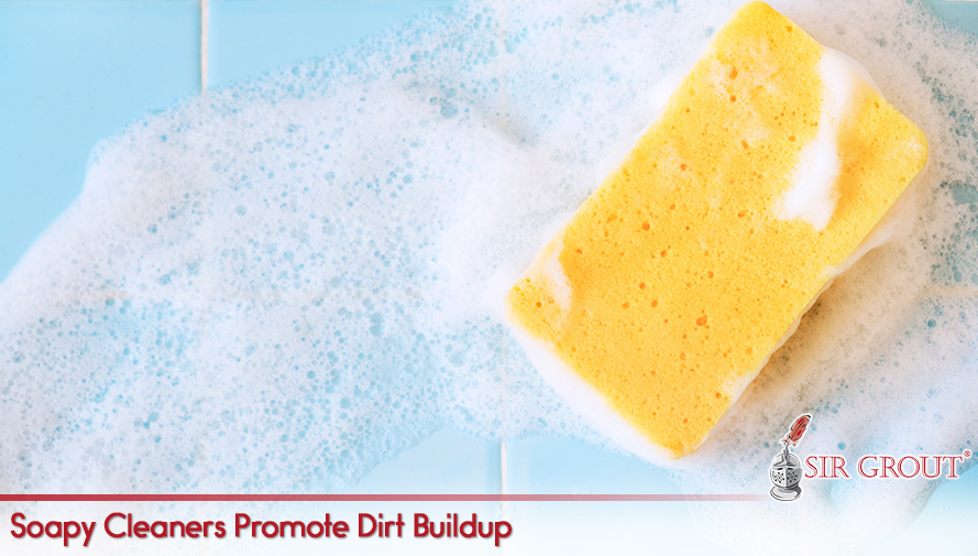Sponge Soaked in Soapy Cleaners Which Promote Dirt Buildup on Tiles and Grout