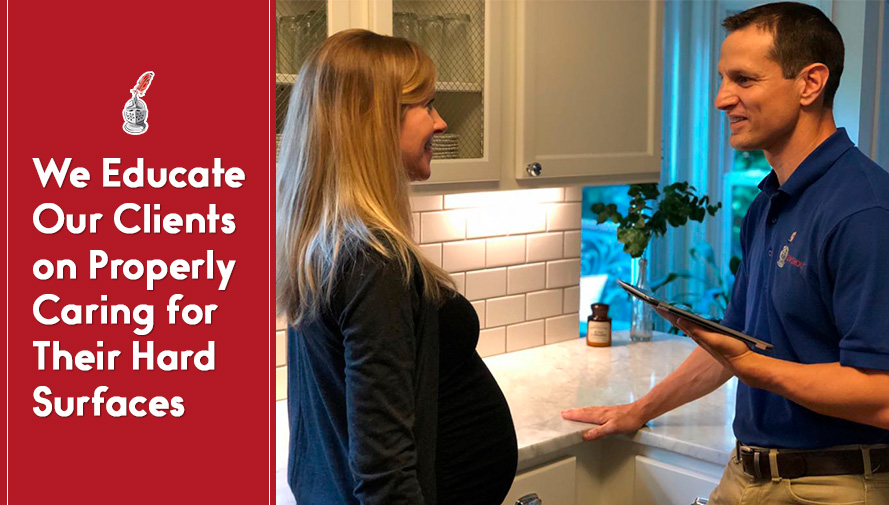 Sir Grout Professional in Kitchen Educating Client on Properly Caring for HerRestored Hard Surfaces